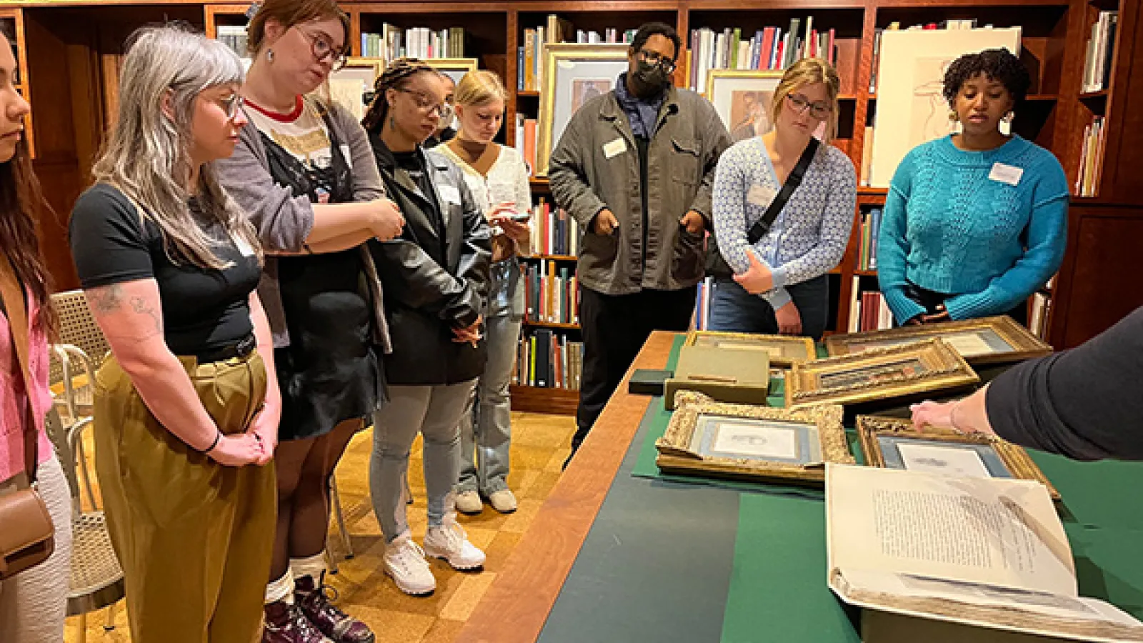 Students viewing drawings.