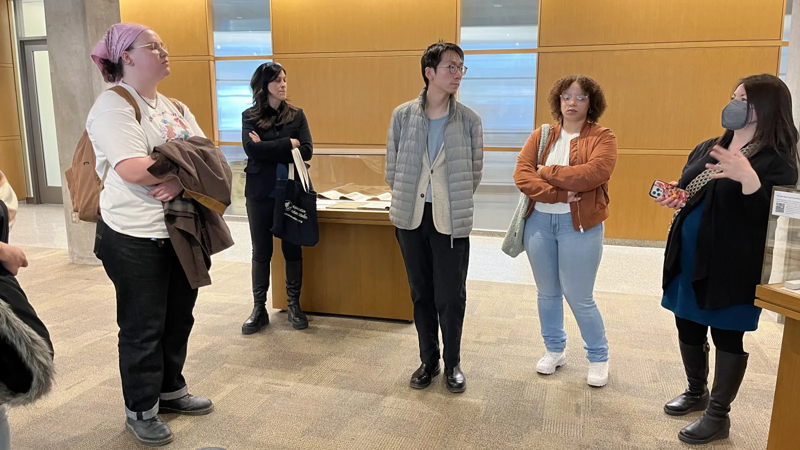Dr. Mathison and students in the exhibition