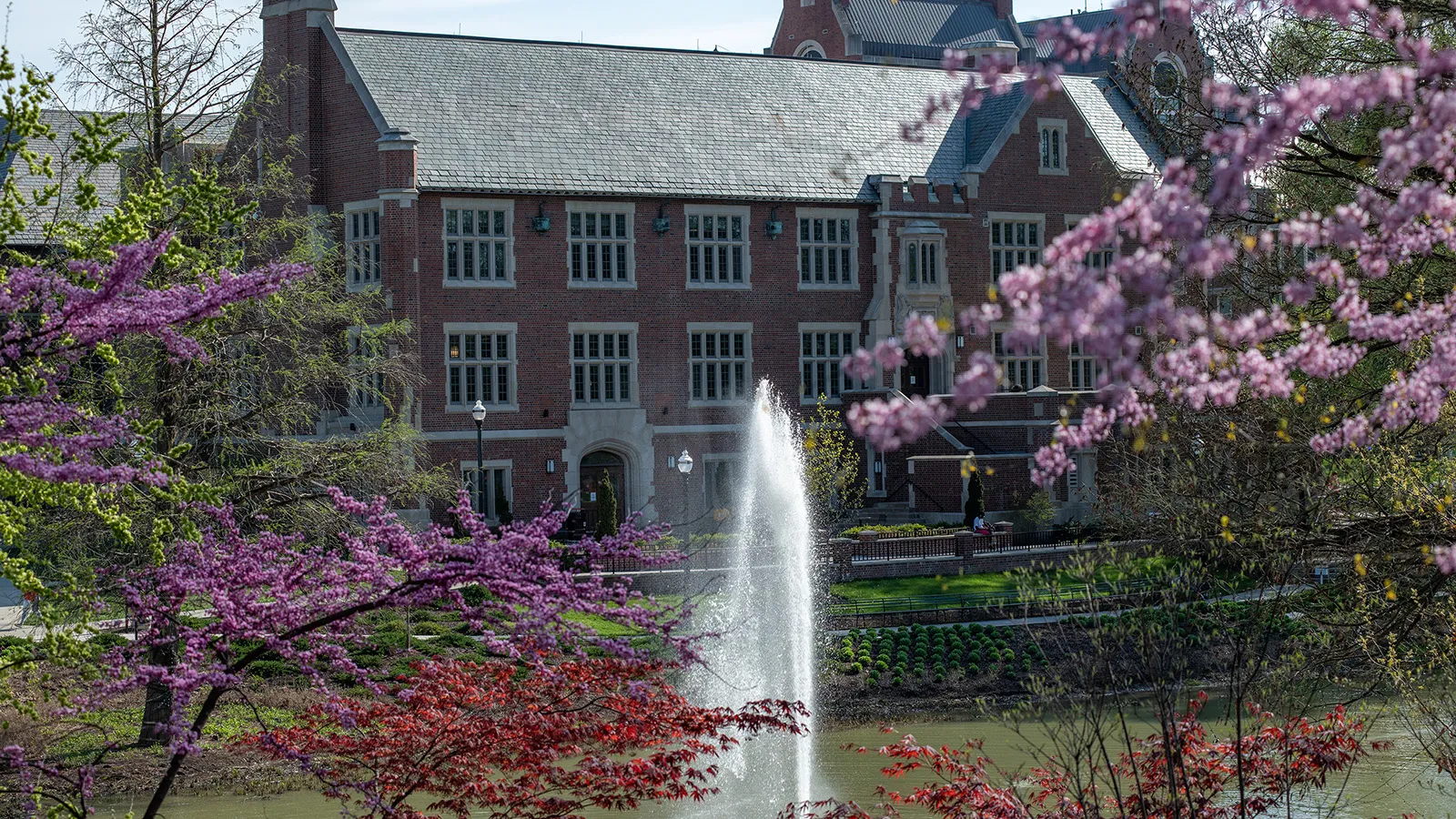Pomerene Hall, home of the History of Art Department, seen on a spring day with Mirror Lake in the foreground