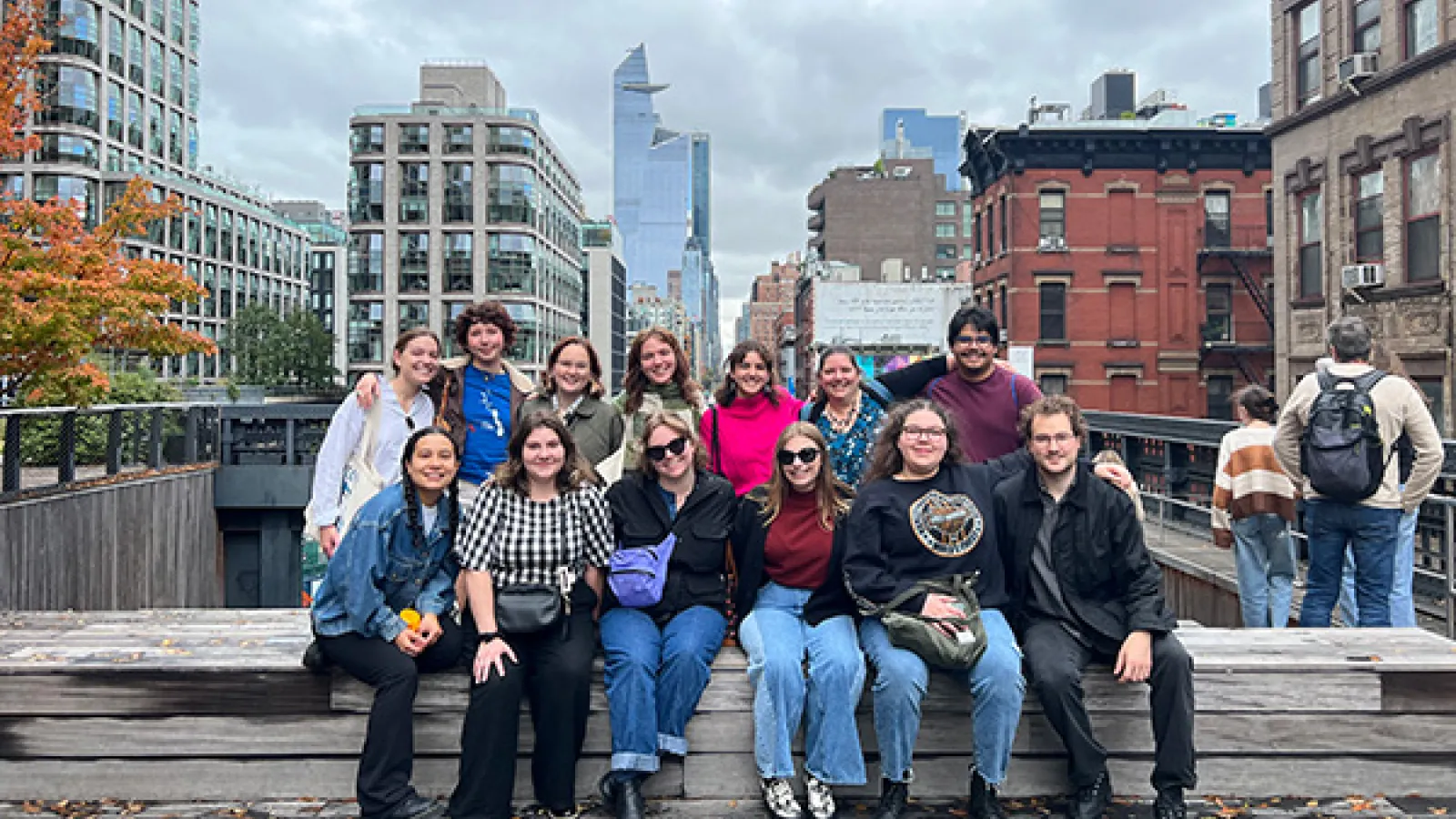 History of Art majors pose together in front of an urban landscape in New York