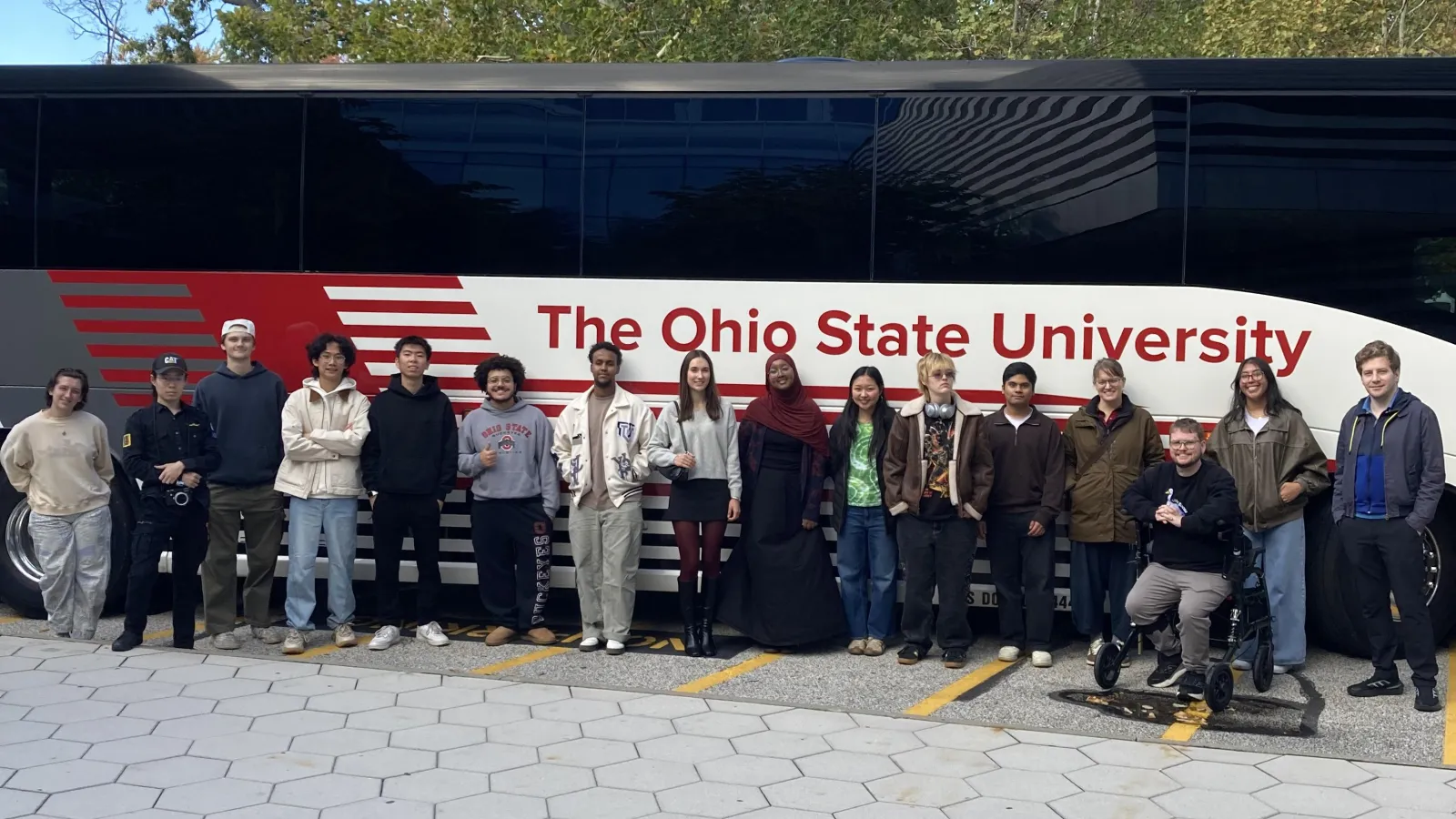 Group of students in front of a bus