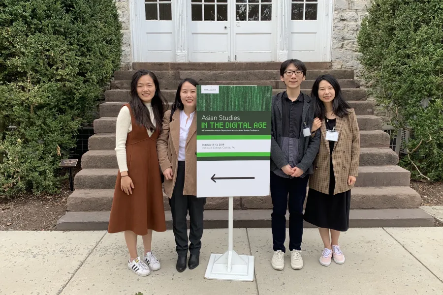 4 students at conference