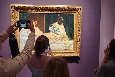 History of Art students viewing Manet's Olympia at the Metropolitan Museum of Art in New York